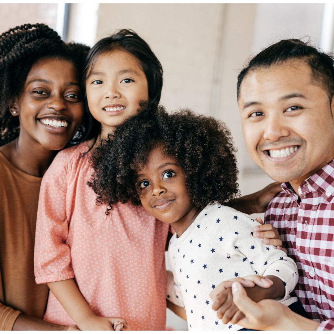 Diverse family smiling together