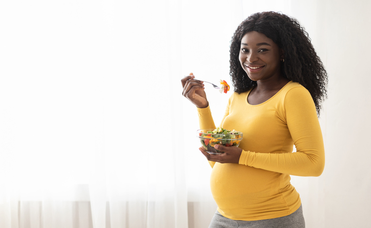 Pregnant mom eating healthy food