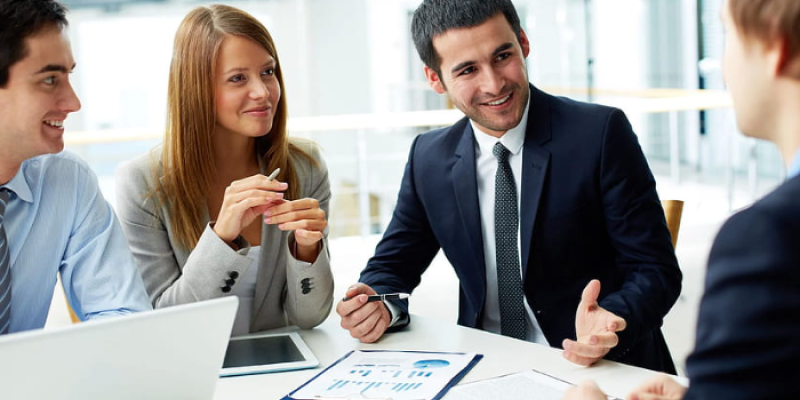 A mother showing her daughter how to write the alphabet
